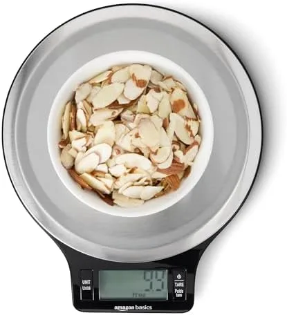 Amazon Basics digital kitchen scale holding bowl of sliced almonds