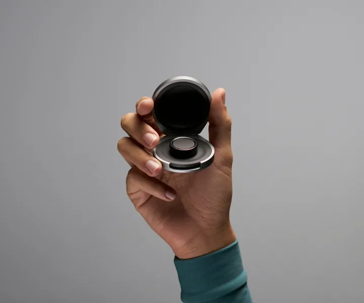 Oura Ring 4 on charger puck during at-home charging