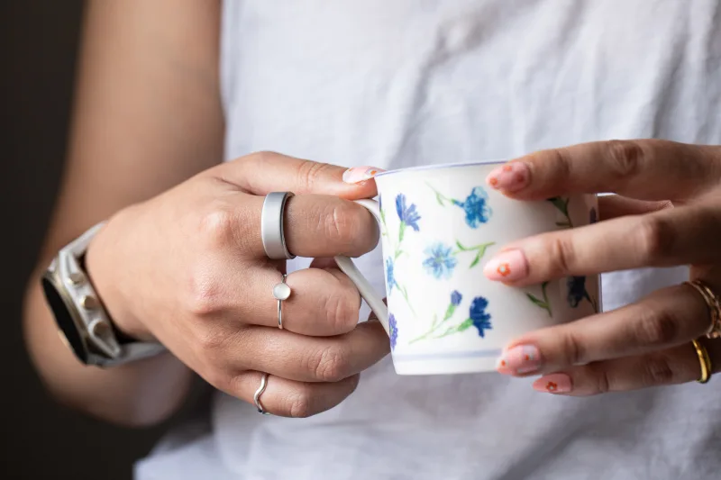 Oura Ring 4 smart ring worn on finger close-up
