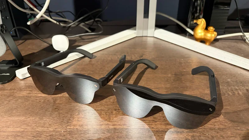 RayNeo Air 4 Pro display glasses on wooden surface