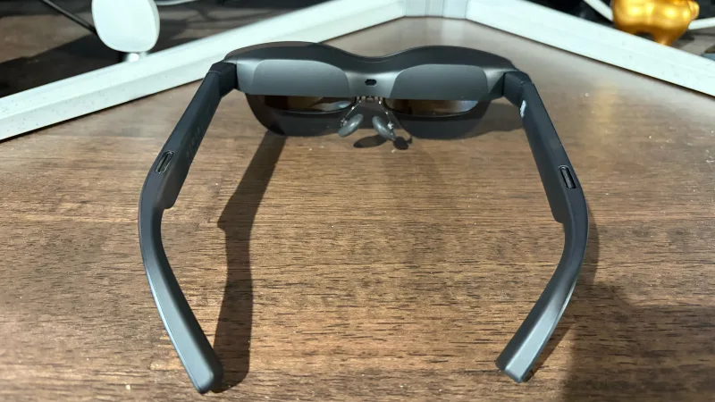 RayNeo 4 Pro display glasses worn on face, front view