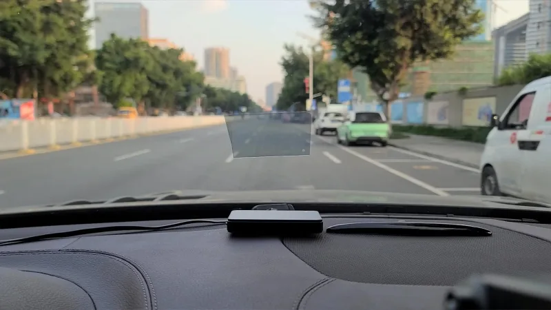 M1 Car HUD projecting speed and direction onto windshield while driving