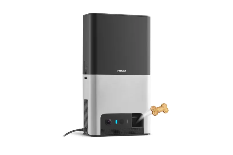 Petcube Bites 2 Lite dispenser tossing a treat mid-air