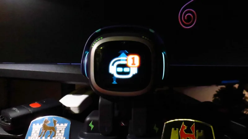 LivingAI EMO showing a firmware update notification on screen