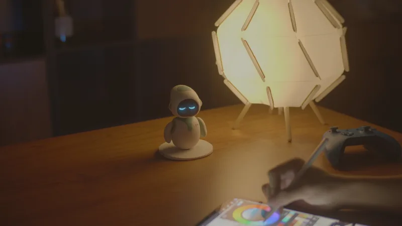 Energize Lab Eilik robot on desk beside tablet and lamp