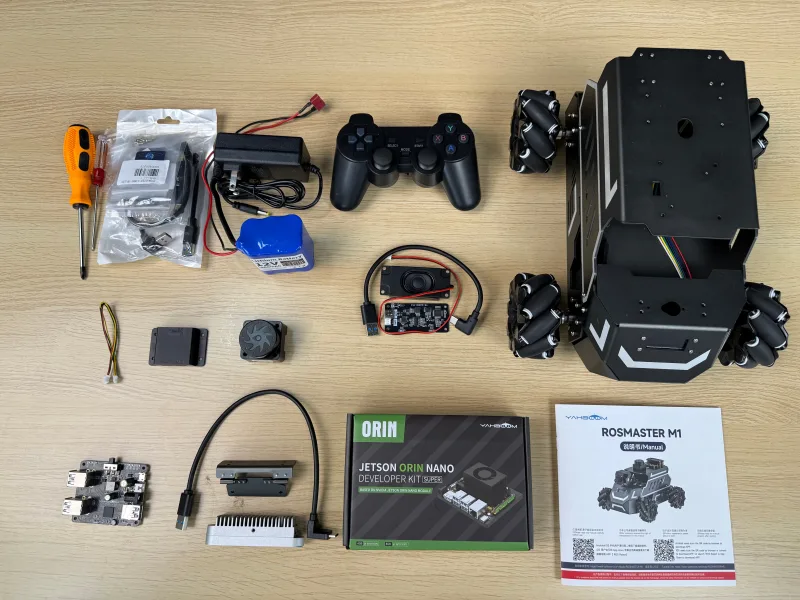 Yahboom ROSMASTER kit components and manuals laid out