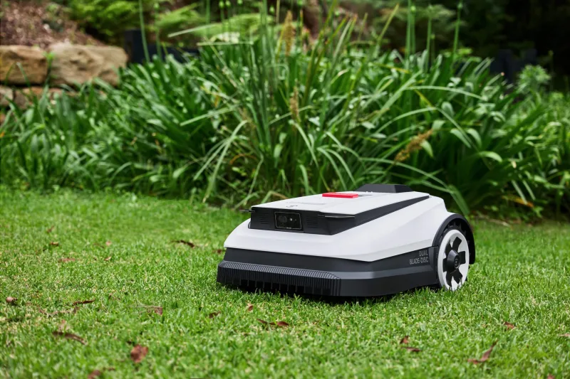 ECOVACS GOAT O1000 RTK robotic mower sitting on grass