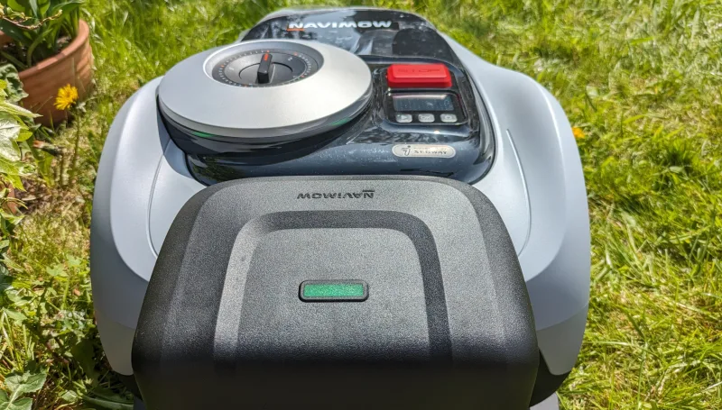 Segway Navimow i105N robotic mower parked at charging station