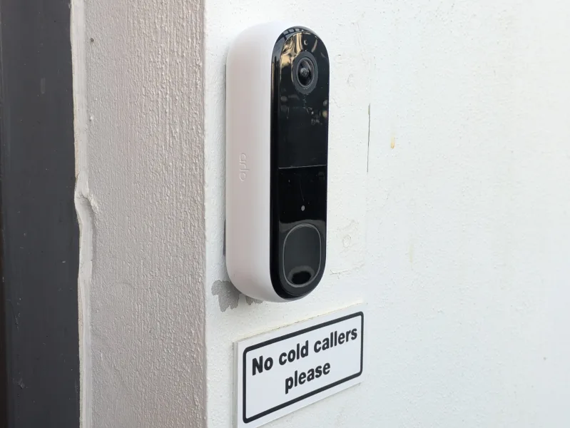 Arlo AVD4001 video doorbell mounted on exterior wall