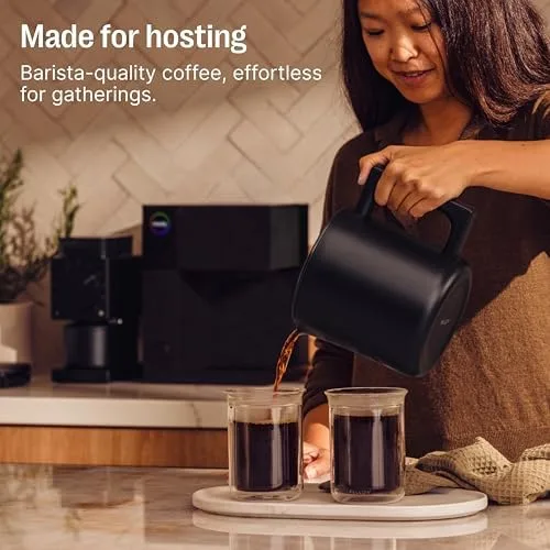 Fellow Aiden thermal carafe pouring coffee into two mugs