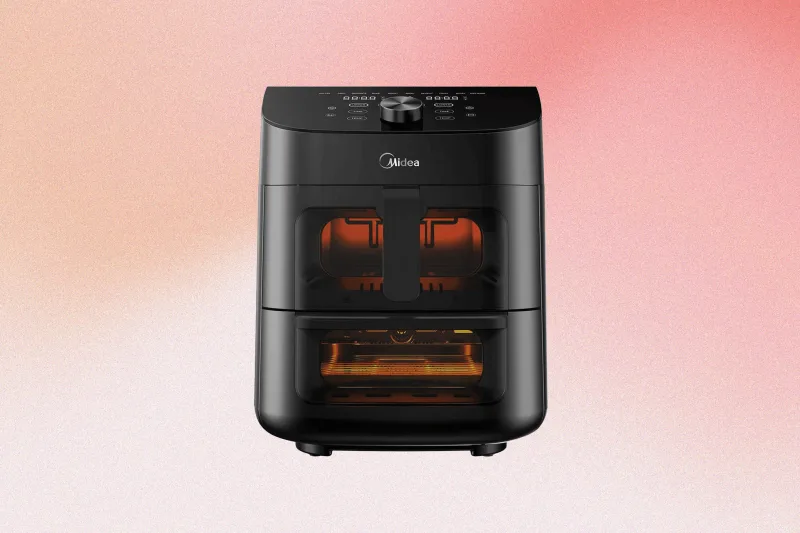 Midea Dual Basket Air Fryer Oven cooking roast chicken in dual compartments