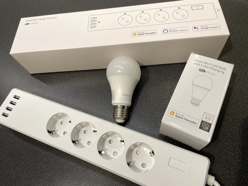 Meross MSS425F smart power strip shown next to smart bulb