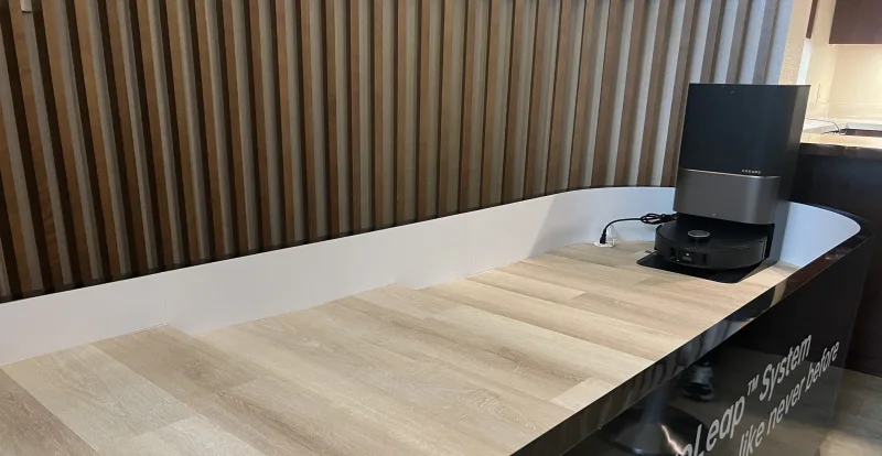 Dreame X50 Ultra robot vacuum displayed on a modern counter